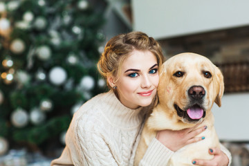 Beautiful teen girl with a labrador dog