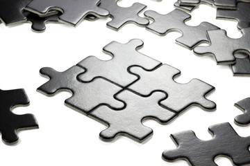 pieces of a jigsaw puzzle isolated on white background