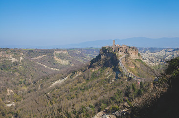 Fototapeta na wymiar View of Civita di Bagnoregio past midday (Viterbo, Italy)