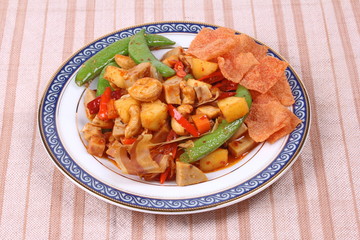 Fried mixed fruit and vegetable with roasted chili plate .