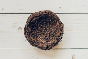 Blank nest on wood background