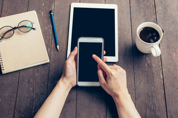 Close up of woman hand holding phone with blank copy space