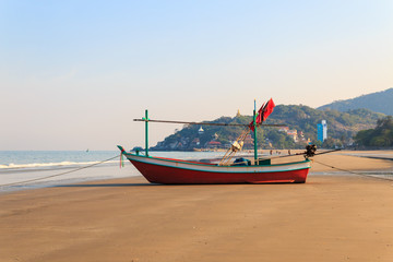 Naklejka na ściany i meble fishing boat on beach