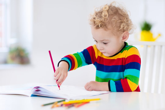 Kids read, write and paint. Child doing homework.