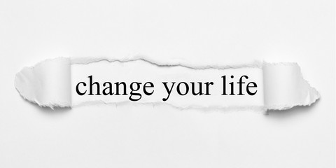 change your life on white torn paper