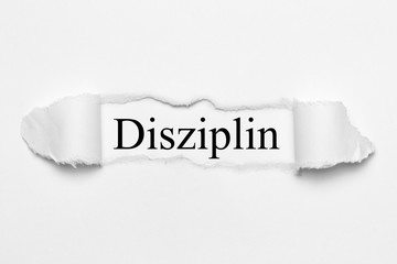 Fototapeta premium Disziplin auf weißen gerissenen Papier