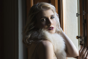 Blond girl posing with vintage clothes
