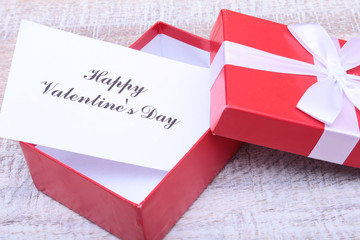 Valentine day composition: red gift box with bow