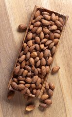 Almonds in old wooden dish