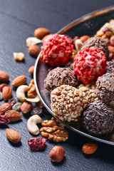 Homemade candy with chocolate , nuts and dried strawberry
