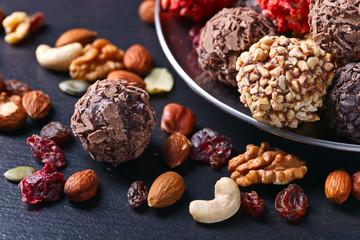 Homemade candy with chocolate , nuts and dried strawberry
