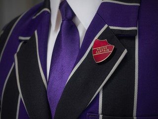 School boys blazer with red house captain school badge