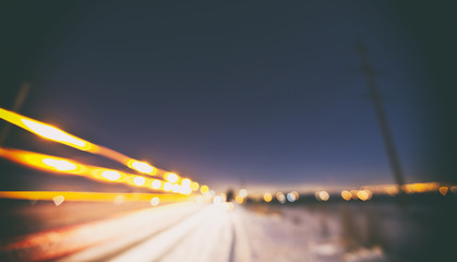 Winter road in the evening and lots of bokeh and light