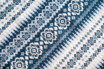 White-blue winter sweater with a beautiful pattern