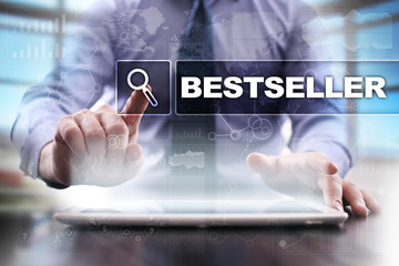 Businessman using tablet pc and selecting bestseller.