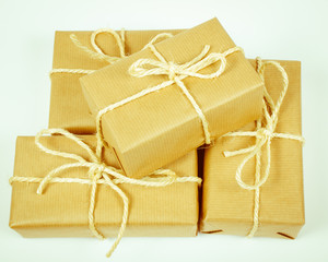 Rustic parcels gift box with kraft paper.