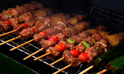 Close up barbecue grills at barbecue party on barbecue grill at countryside in holiday.BBQ with pineapples,outdoor party..