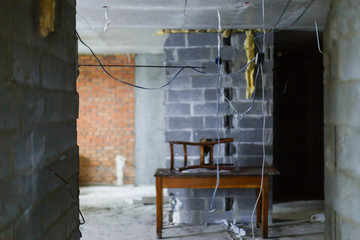 Building repairs at home. Incandescent and wires in the room with plaster.