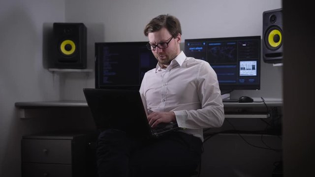 Computer to the room. The person with points and the laptop on a hand, tries to find the necessary information. The geek enters bystry data into the laptop the Guy is very concentrated