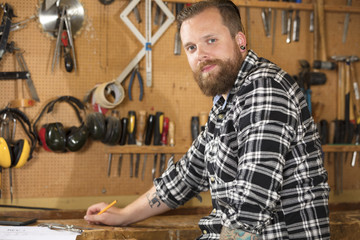 Environmental portrait of a carpenter in workshop