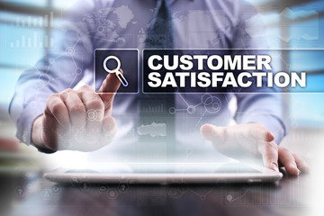 Fototapeta na wymiar Businessman using tablet pc and selecting customer satisfaction.