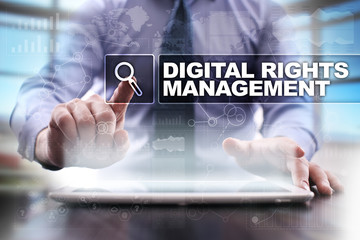 Businessman using tablet pc and selecting digital rights management.