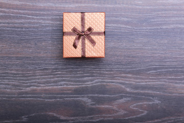 Beautiful gold, red present gift box and ribbons on backgound