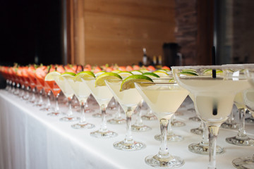 Many tasty colorful cocktails at a party, refreshments