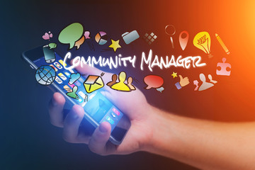 Concept of man holding smartphone with community manager title a