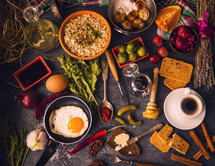 Table with food in breakfast or lunch: omelette, cabbage, oil, c