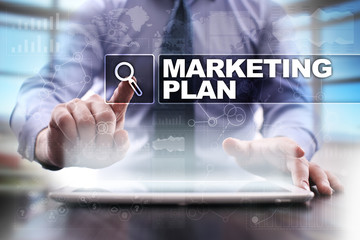 Fototapeta na wymiar Businessman using tablet pc and selecting marketing plan.