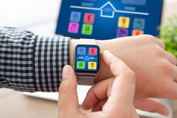 man hands with watch and notebook app smart home screen