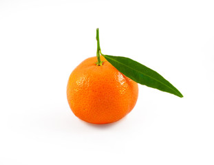 Orange tangerine with green leaves on a white background isolated image