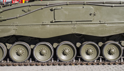 Obraz na płótnie Canvas Steel Military tank, detail of tracks or wheels of the off-road