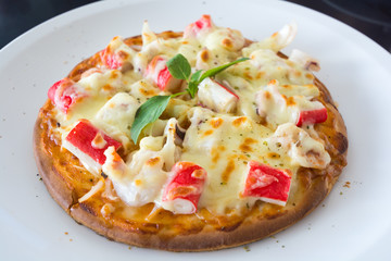 Thai style seafood Pizza  on white dish