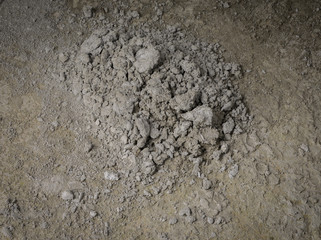  midden of cement on concrete floor at construction site