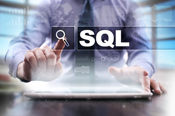 Businessman using tablet pc and selecting sql.