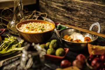 Table with food in breakfast or lunch: omelette, cabbage, oil, c