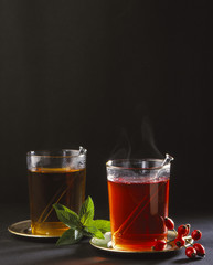 2 glasses with fruit tea, rosehips and peppermint