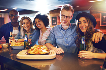 People having snacks and beer at bar