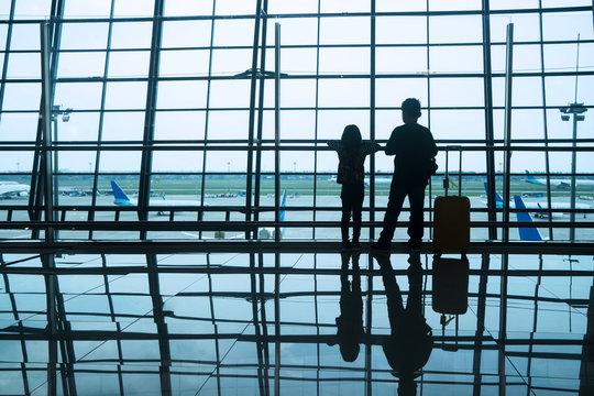 Silhouette children in airport