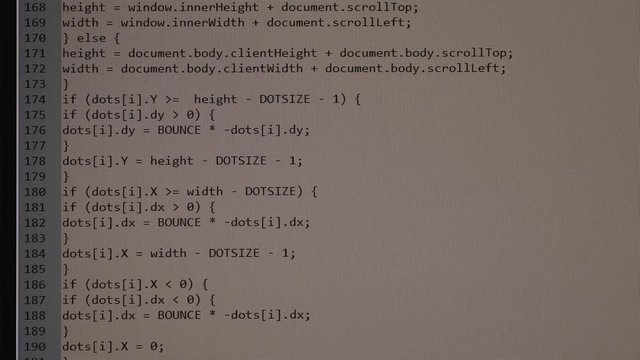 The process of writing a computer program on a computer screen. Text is entered and quickly moved up. A large number of rows of symbols.