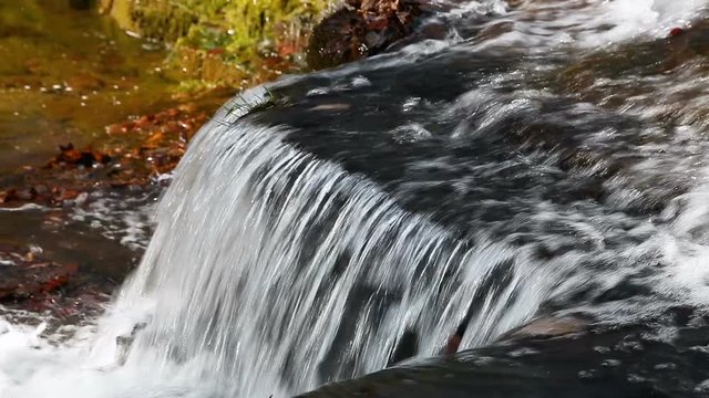 Water splashes over Clinton Falls, a small beautiful waterfall in rural western Indiana.