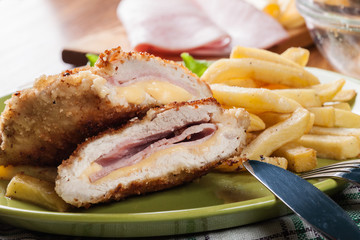 Cutlet Cordon Bleu with pork loin served with French fries and salad