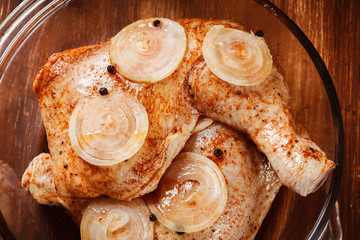 Raw chicken legs marinated