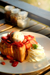 Dessert honey toast with ice cream and strawberry for romantic sweet time in valentine's day 