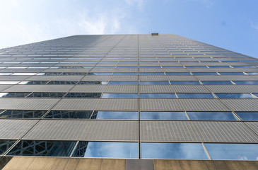 Worker Cleaning Office Tower Windows