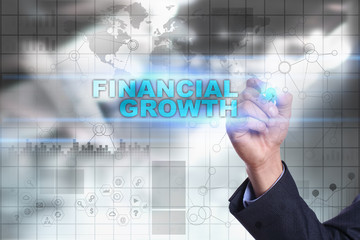 Businessman is drawing on virtual screen. financial growth concept.