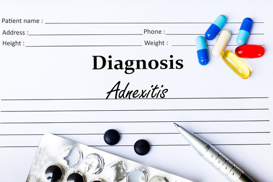 Adnexitis - Diagnosis written on a piece of white paper with medication and Pills