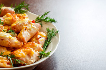 Roast chicken with fennel on a white wooden background